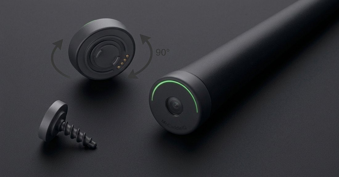 The round grip sensor and its base, which twist-locks into the butt of the club
